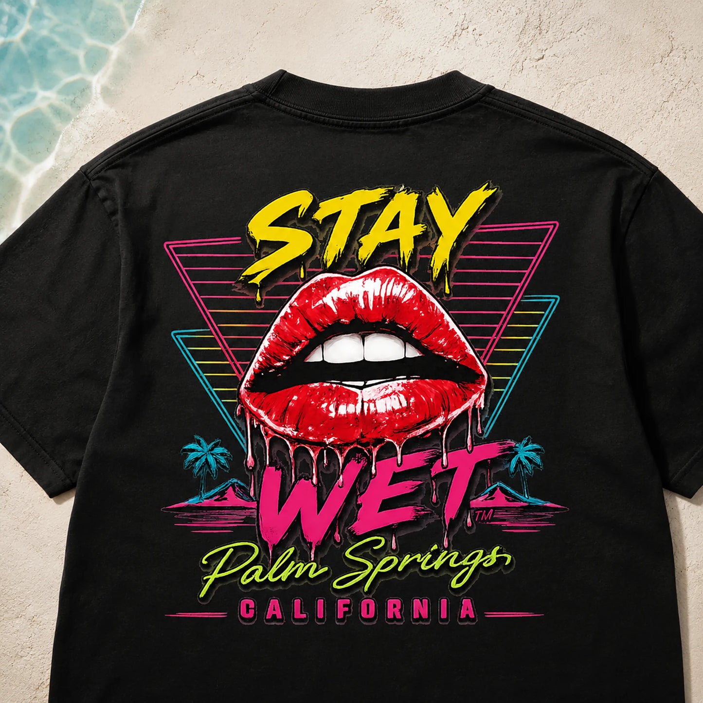 Close-up of the large Hot Lips and Triangles back graphic printed on a black Stay Wet tee
