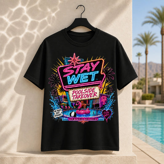 Black Stay Wet Poolside Takeover Pink Flamingo graphic tee featuring a large neon front print