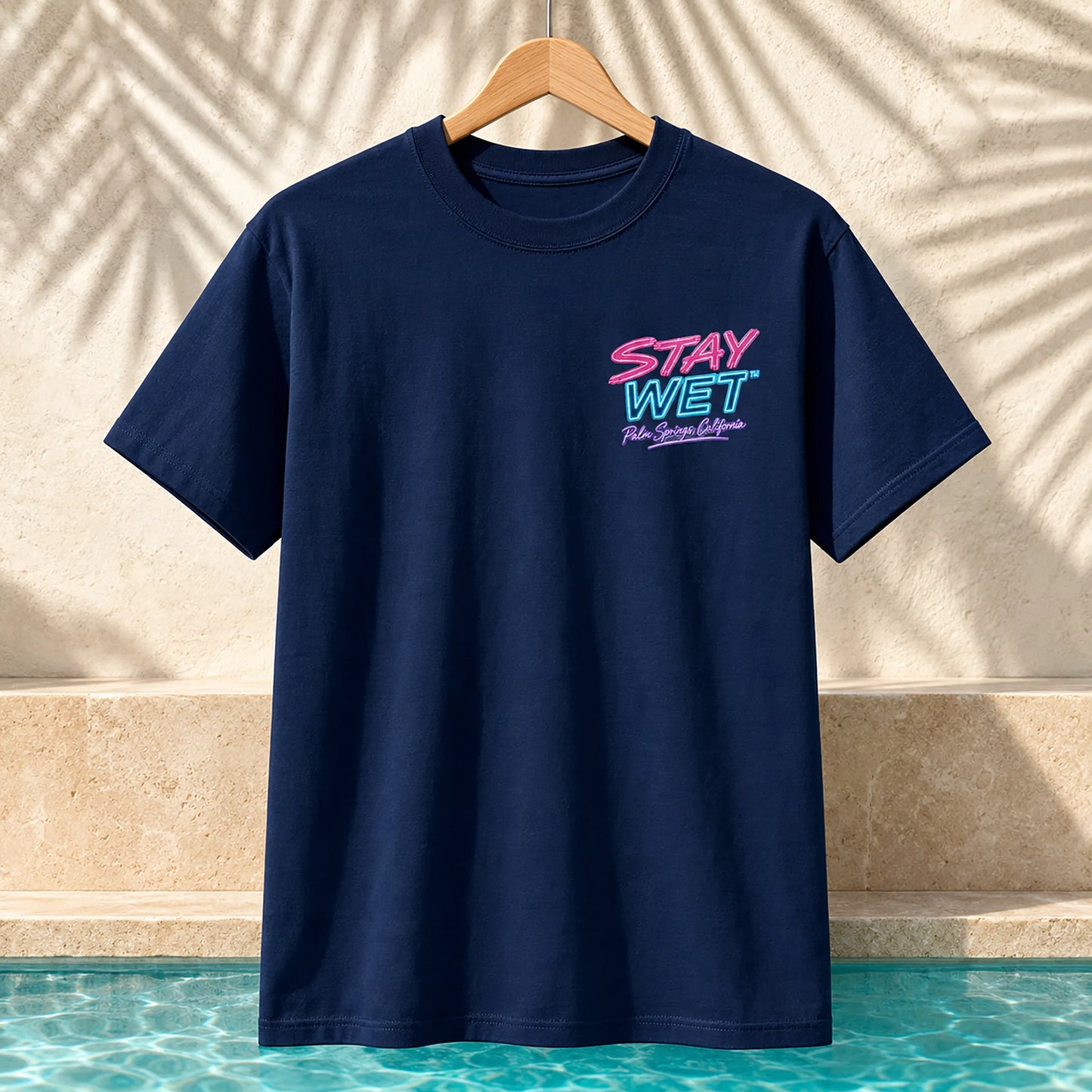 Navy Stay Wet Poolside Takeover Pink Flamingo front and back tee mockup showing the small left-chest print